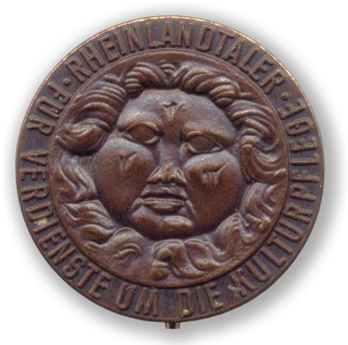 Rheinlandtaler Bronzefarbene Plakette Rheinlandtaler mit plastischem Gesichtsmotiv